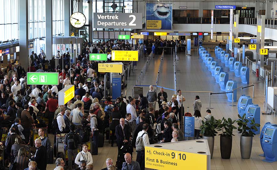 Passengers wait after the cancellation of flights at Schiphol Airport in Amsterdam, Netherlands