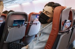 nogeoingegneria com climate change geopolitica man sleeping on plane e1596232839897